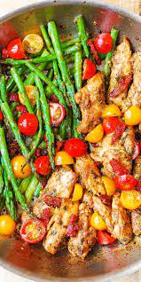 One Pan Pesto Chicken And Veggies Sun Dried Tomatoes Asparagus Cherry Tomatoes Healthy Gluten Free Mediterranean Recipes Mediterranean Diet Recipes Food
