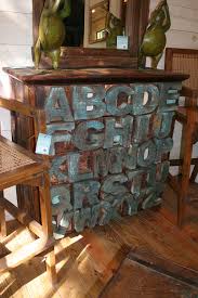 A gray boys nursery design completed with a distressed alphabet carved dresser showcasing decor and a rope table lamp. Reclaimed Teak Alphabet Chest Of Drawers Dresser Repeatable Collection Flickr