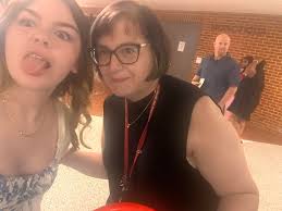 Can someone fix the lighting in this photo? This is my 8 year old daughter.