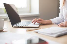 A woman on her computer.