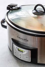 An electric cooker consisting of an earthenware pot inside a container with a heating. Slow Cooker Guide Everything You Need To Know Jessica Gavin