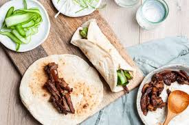 Since the pork is already cooked it only takes about an hour on the oven to infuse delicious mexican flavors that become the base of some of the tastiest tacos. Crispy Asian Lamb Wraps Leftover Roast Lamb Mrs Jones S Kitchen