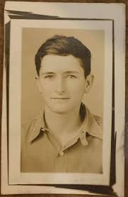 Photo of Jimmy Lawler, youngest son of Roy and Emma Lawler and his  graveside at Corinth Cemetery, following a car accident resulting in his  death. According to Dempsey Lawler, Judd Lawler was