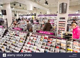 rows of pop music cds in hmv record shop london england