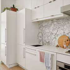 The venetian plaster range hood, simple cabinets and floating shelves evoke an earthy english cottage. The Best Ikea Hacks On The Internet Architectural Digest
