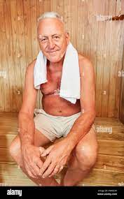 Senior man sits relaxed in the sauna in his wellness hotel vacation Stock  Photo - Alamy