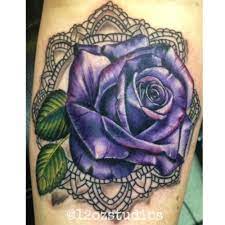 By dubuddha june 2, 2016. Beautiful Full Color Cover Up Featuring A Bright Purple Rose In An Ornate Frame Tattoo By Meghan Patrick Purple Rose Tattoos Purple Flower Tattoos Rose Tattoos