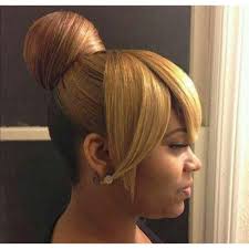 Elegant short hairstyles for women over 50. The Stylish Bun With Bangs Askhairstyles