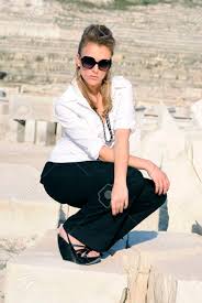 Unlike the classy and refined white, black displays a sense of unbridled power and fearlessness and there is an unexplainable refined enigma about a man dressed in a black shirt. Stylish Girl In Black Pants And White Shirt Stock Photo Picture And Royalty Free Image Image 22252657