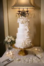 White wedding cake cascading flowers. Four Tier White Classic Wedding Cake With White Cascading Sugar Flowers Wedding Photographer Carrie Wildes Photography Marry Me Tampa Bay Most Trusted Wedding Vendor Search And Real Wedding Inspiration Site