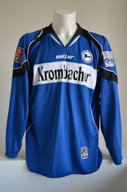 The club has 12,000 members and the club colours are black, white and blue. Arminia Bielefeld 2005 06 Home Kit