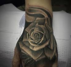 Grey And Black Rose Tattoo On Hand Rose Hand Tattoo Hand Tattoos Tattoos
