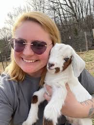 What breed is the baby goat mixed with?
