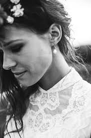 long haired girl in white shirt glancing to her left side by Christine  Blaylock. Photo stock