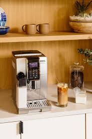 De'longhi ecam35025sb dinamica truebrew over ice fully automatic coffee and espresso machine, with premium adjustable frother, stainless steel 4.4 out of 5 stars 155 2 offers from $1,650.00 Photo 4 Of 6 In A Bespoke Coffee Station Recalls The Java Dreams Of A Couple S Former Life In Brazil Dwell