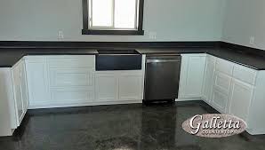 Matching black pearl granite with white cabinets is modern, and with oak classy. Black Pearl Brushed Granite