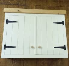 White Planking Farmhouse Style Cabinet With Contrast Black Tee Hinges Kitchen Cabinets Hinges Hinges For Cabinets Cabinet Styles