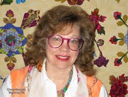 Cheryl Kerestes of Wyoming, PA, wins the Best Home Machine Workmanship  Award in the AQS QuiltWeek®