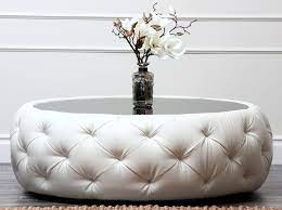 The ottoman is upholstered in fin. Round Tufted Ottoman Coffee Table Ideas On Foter