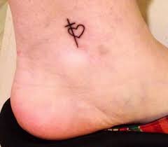 The result is a one of a kind tattoo design. 19 Pretty Cross Heart Tattoo Design Ideas Entertainmentmesh