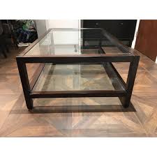Table is designed to hold magazines and books underneath the glass. Pottery Barn Glass Wood Coffee Table Aptdeco