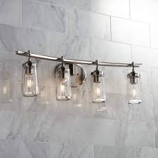 The versatile up or down mounted design is showcased by curved, gooseneck arms and a smooth, rounded back plate to suit multiple styles Poleis 32 Wide 4 Light Brushed Nickel Bath Vanity Light 9g441 Lamps Plus
