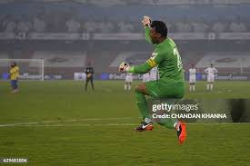 Kerala Blasters FC's goalkeeper Sandip Nandy looks to save the ball... News  Photo