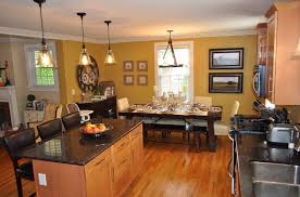 The kitchen, dining room and living room are beautifully distinguished by placing large jute chenille rugs in the center of each area while wood is used as a common material in the three spaces to merge them cohesively. Best Living Room Ideas Stylish Living Room Decorating Small Open Kitchen With Living Room Designs In India