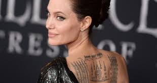Angelina jolie has been in the news constantly because of her love for tattoos. Angelina Jolie New Tattoo Heavy With Meaning Brad Pitt Still Takes It Up His Rank