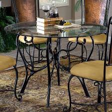 I am thinking about getting a glass top dining table. Wrought Iron Kitchen Table Ideas Wrought Iron Dining Table Kitchen Table Settings Round Glass Table
