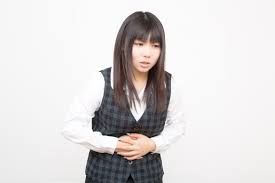 お腹が痛い女性の写真素材 - ぱくたそ