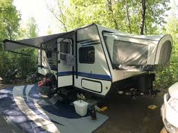 30 Of The Best Places To Go Camping In Wisconsin Beyond The Tent Hybrid Travel Trailers Travel Trailer Camper Flooring