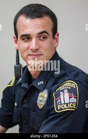 In this Monday, April 17, 2017 photo, Columbus Police officer Tony Kummer  listens as Paula Arnold talks about how grateful she is for the response  from Columbus Police Department to rescue her son Caleb Arnold during an  interview at the Columbus ...