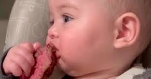 Mum feeds baby rare steak and claims six-month-old loves it as part of  'baby-led' weaning programme