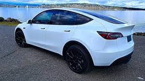 How do tesla model 3 and model y compare in terms of range and energy consumption efficiency? 2020 New Tesla Model Y Review Interior Exterior Youtube