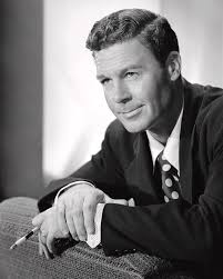Smiling John Archer Sitting With Cigarette In Hand Photograph by Globe  Photos