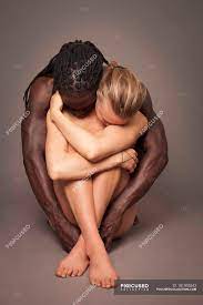 Naked multicultural couple sitting on ground and hugging — African Descent,  intertwined - Stock Photo | #181905342