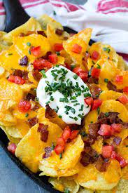 Irish Nachos Are Potato Chips With Melted Cheese And An Assortment Of Toppings Irish Nachos Best Nacho Recipe Irish Nacho Recipe