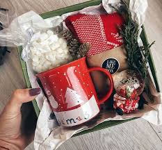 A holiday coffee gift basket filled with popular starbucks coffee, starbucks mugs, tea along with biiscotti. 20 Diy Christmas Gift Baskets Your Family And Friends Will Love