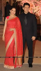 Madhuri Looked Stunning In A Red Sari As She Posted With Dr Nene Indian Wedding Wear Saree Designs Bollywood Fashion
