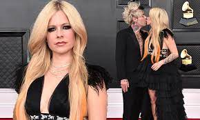 Grammys 2022: Avril Lavigne channels punk glam in a black ruffled gown and  kisses boyfriend Mod Sun | Daily Mail Online