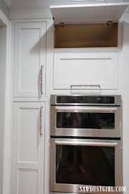 Plate racks and stemware organizers hold breakables safely within reach. Installing Lift Up Stay Open Cabinet Door Hardware Sawdust Girl