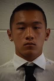 Justin Newcomb, right, is the new coach at Cousino…