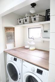 Hardwood on the top of washing & drying machines not only gives you a lot of extra for your things storage but also looks amazing in your farmhouse laundry room! Home Farmhouse Laundry Room Lauren Mcbride
