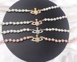 Saturn orb pendant necklace very suitable for parties gold diamonds pearls three rows length 16 comes with box, dust bag and cleaning cloth. Vivienne Westwood Pearl Necklace 16 Inches Vivian Westwood Necklace Pearl Necklace Gold Pearl Necklace Classy Jewelry Pearl Necklace Vintage