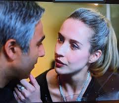 Why does Claire's hair appear less grey in some scenes?