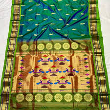 The saree sparkle with elegance and beauty. Maharani Pure Handwoven Paithani Saree Teal Blue Glamwiz