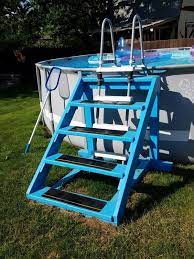 Above Ground Pools With Decks 20 Awesome Photo An Essential Guide For Those Looking At Installing An Pool Ladder Above Ground Pool Landscaping Pool Steps