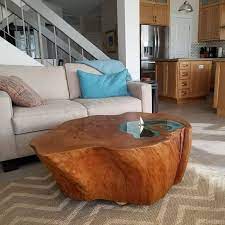 A tree trunk coffee table of the best quality in combination with the right finish ensures the most beautiful appearance. Man Builds Lake Coffee Table From A 400 Year Old Tree Trunk