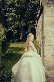 Handmade sage pinafore dress oakandthelittlefolk on etsy. Small Girl Kid With Long Blonde Hair And Pretty Smiling Happy Face In Prom Princess White Dress Standing In Garden With Green Grass Sunny Day Outdoor Stock Photo Picture And Royalty Free